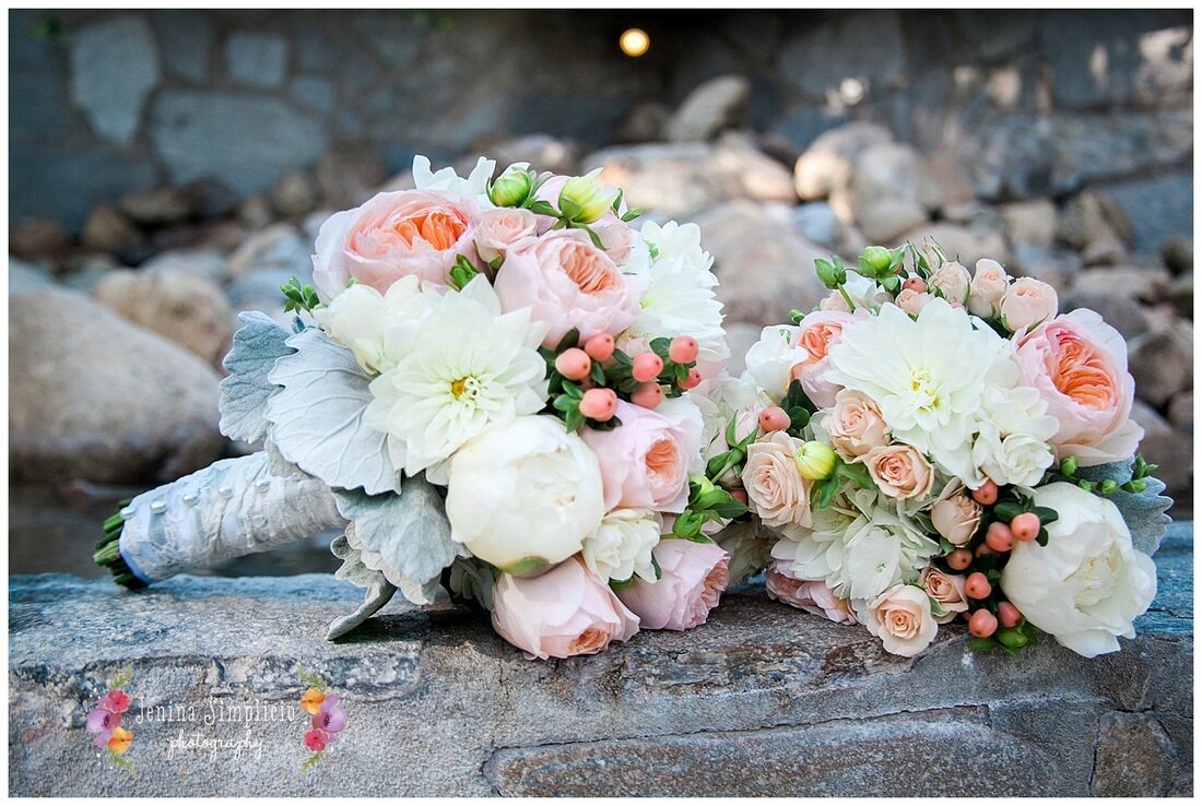  flower bundles and bouquet resting on the rock wall of the garden 