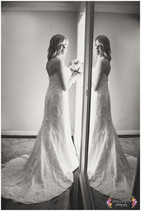  black and white image of bride in the ballroom 