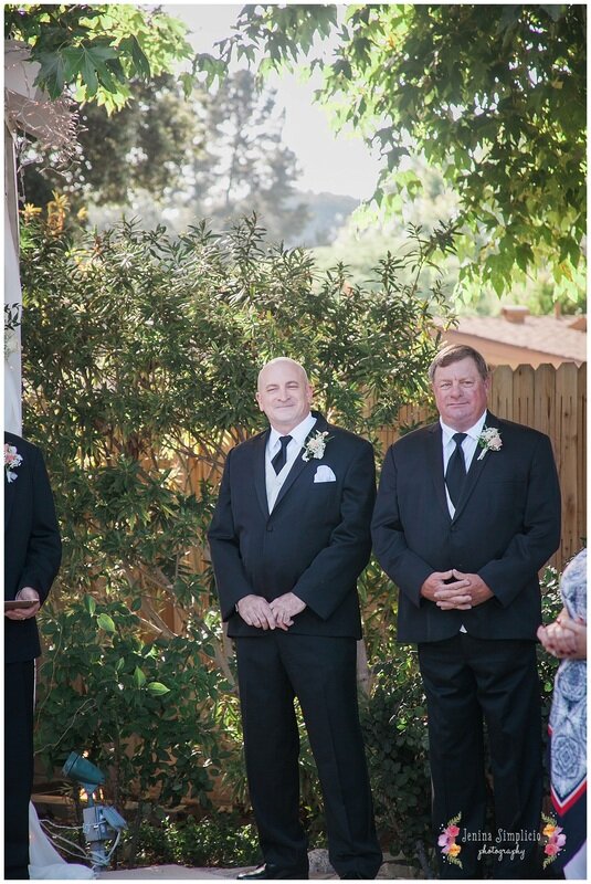  groom and best man waiting at the altar 