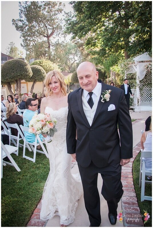  close up of bride and groom walking down the aisle 