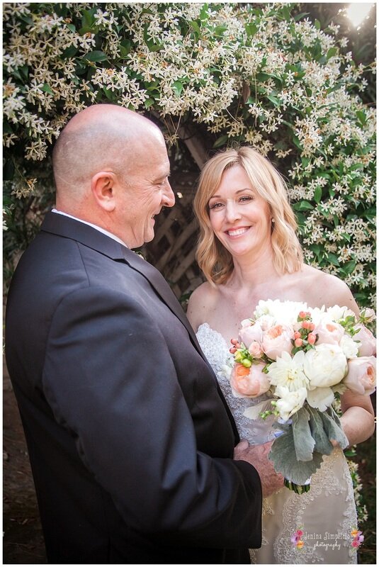  bride and groom smiling and happy with bouquet 