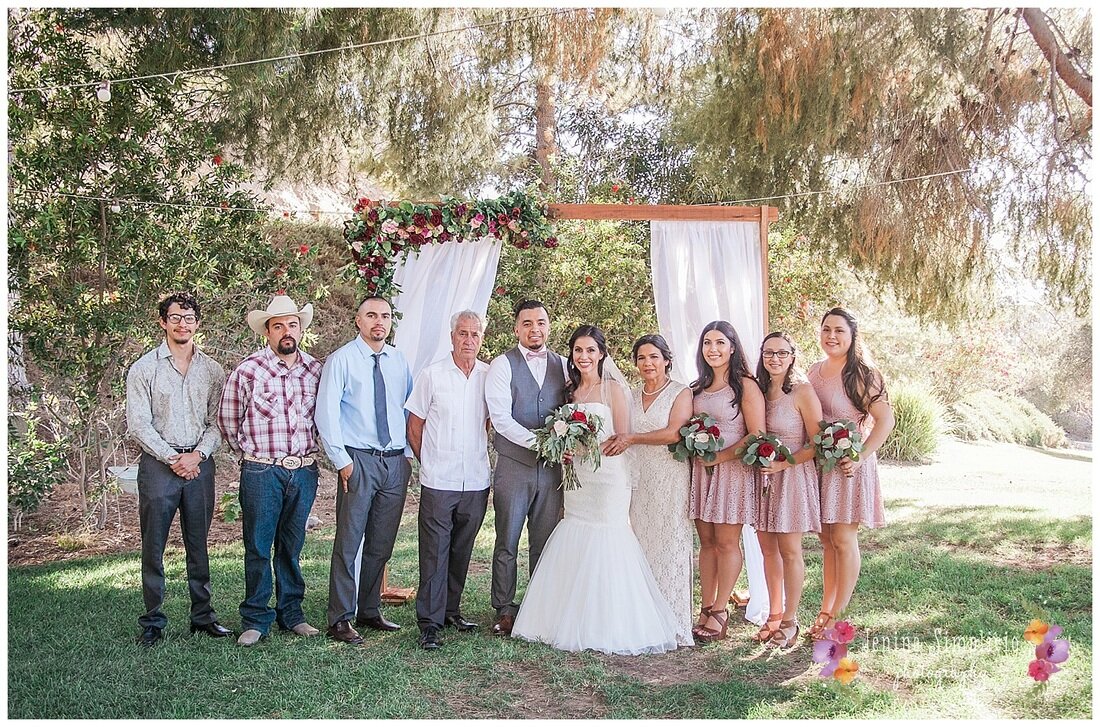  newly weds and their family at the ranch altar 