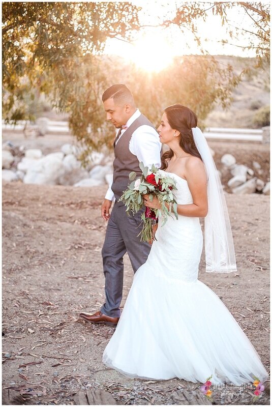  bride and groom walk along the ranch hand in hand 