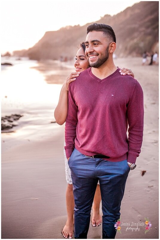  newly engaged couple on the beach at sunset 
