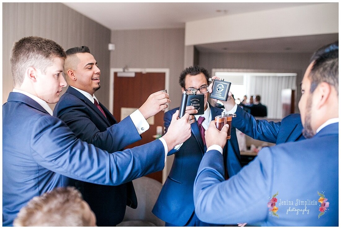  groomsmen share a toast before the ceremony 