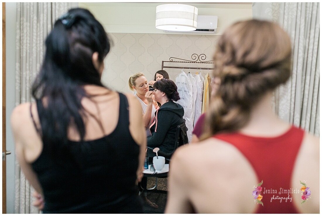  bride getting her makeup done before the ceremony 