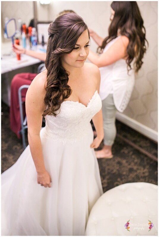  bride looking in the mirror 