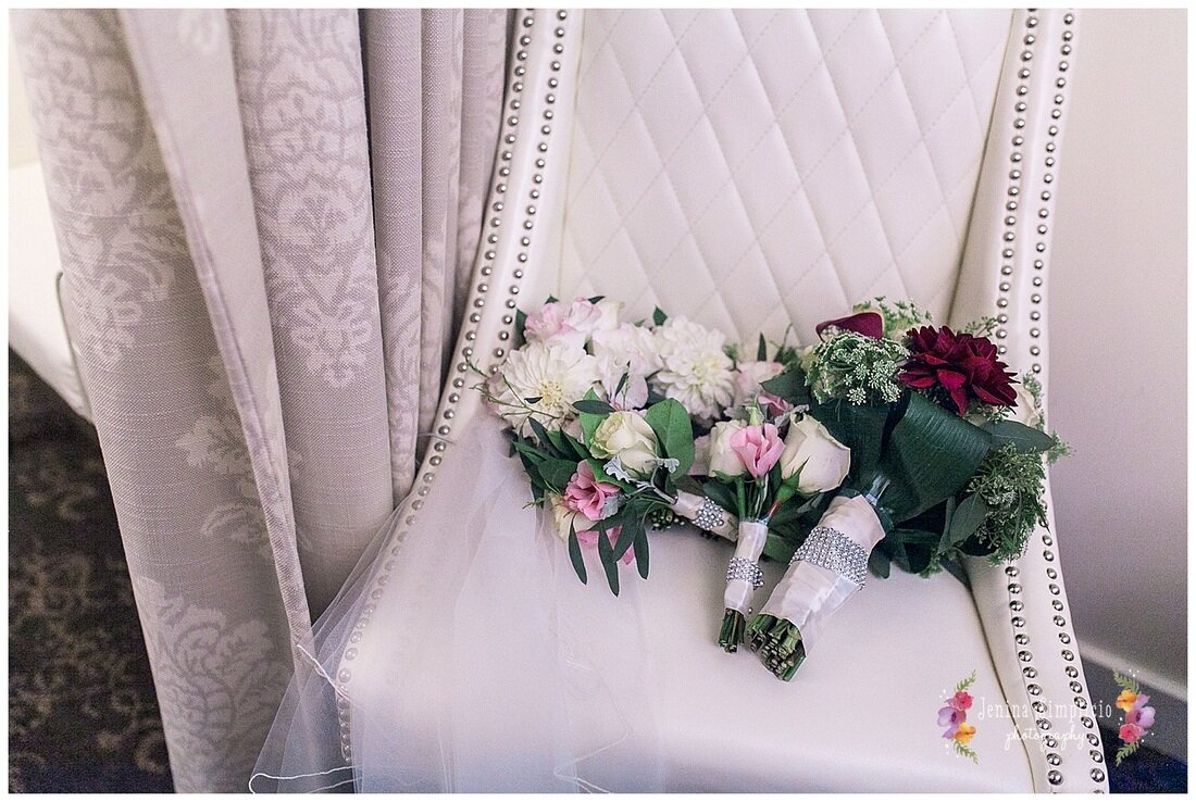  bridal party bouquets and veil on a chair 