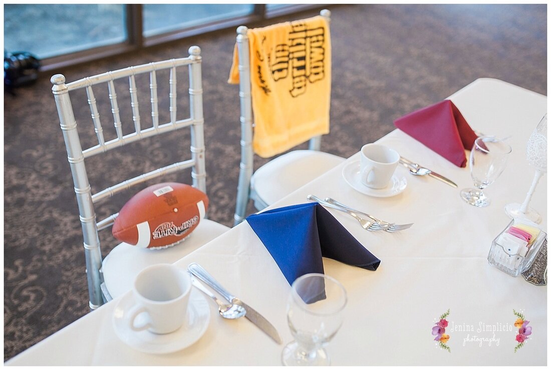  football and towel at the bride and grooms seats in the reception hall 