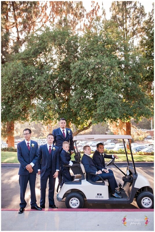  groomsmen arriving to the ceremony on a gold cart 