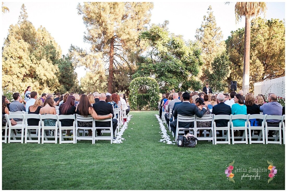  guests sitting at the reception outside 
