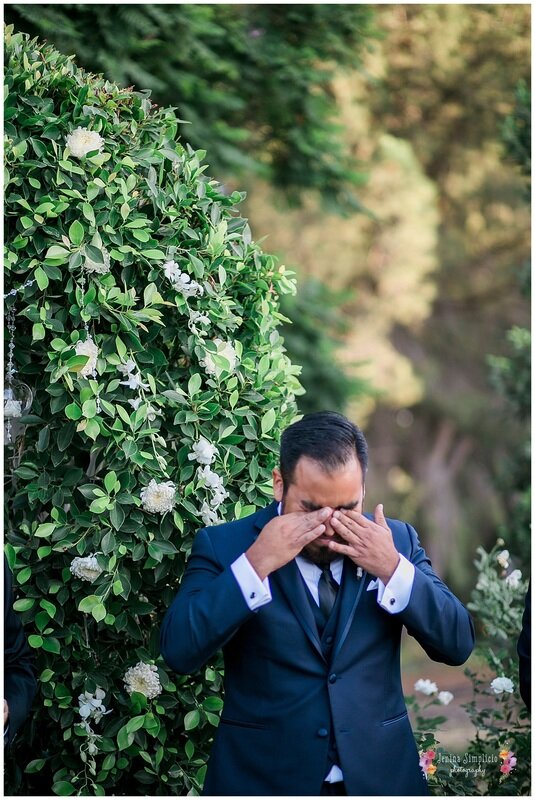  groom crying as he sees his bride walk down the aisle 