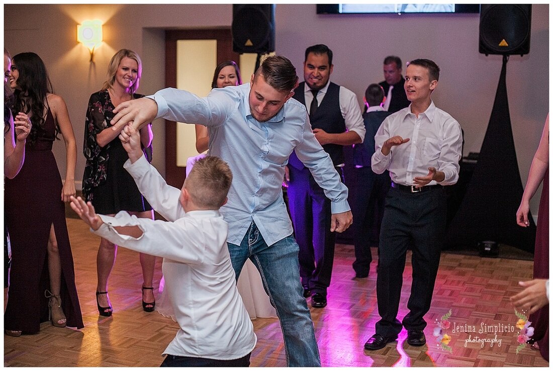  younger guests dancing during the reception 