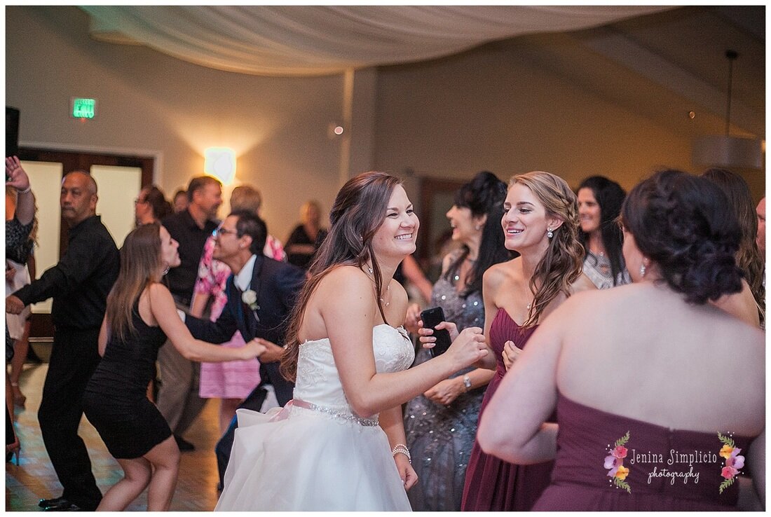  bride and maid of honor enjoying the reception 