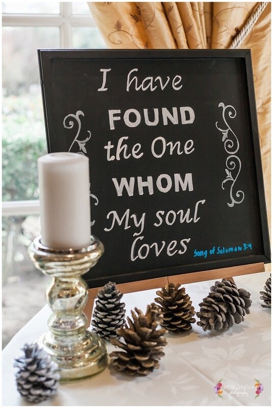  blackboard saying i have found the one whom my soul loves surrounded by candles and pinecones 