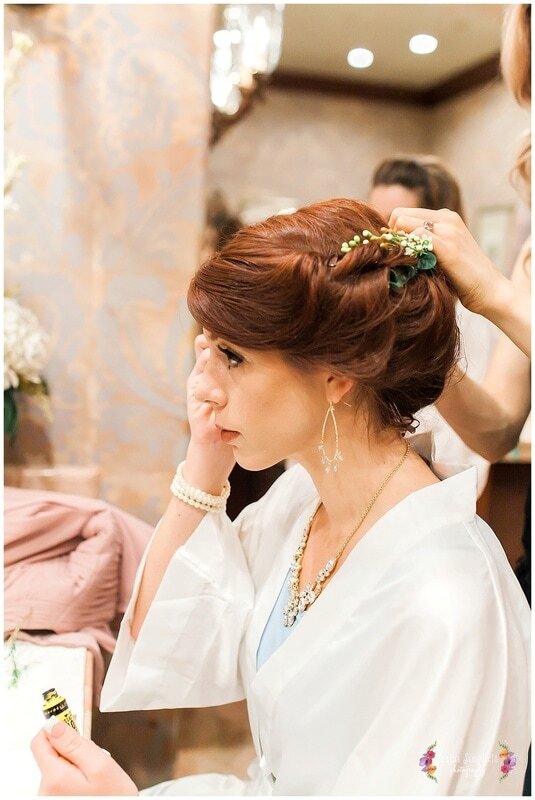  bride getting her final touches on her hair 