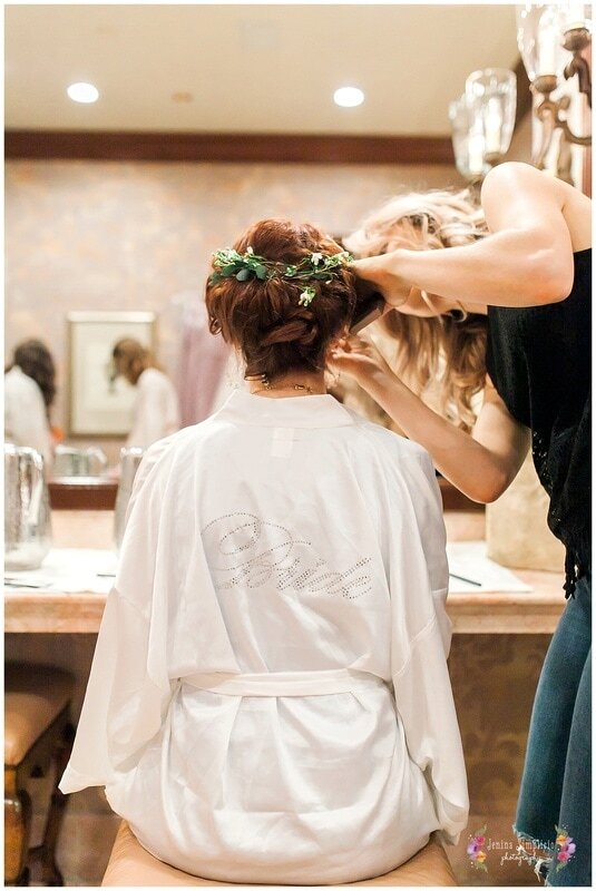  bride in her robe getting her hair done 