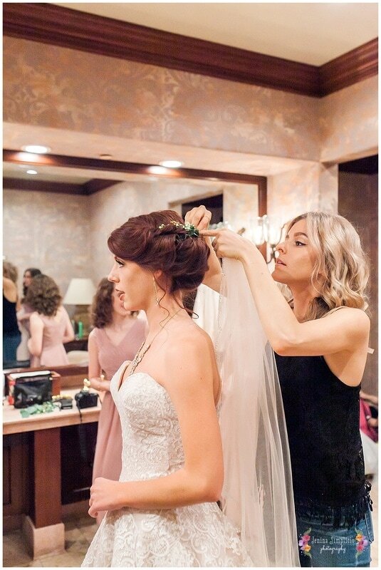  bride getting final touches on her hair 