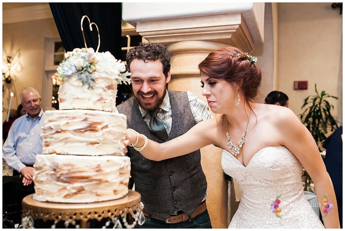  bride and groom cut the cake 