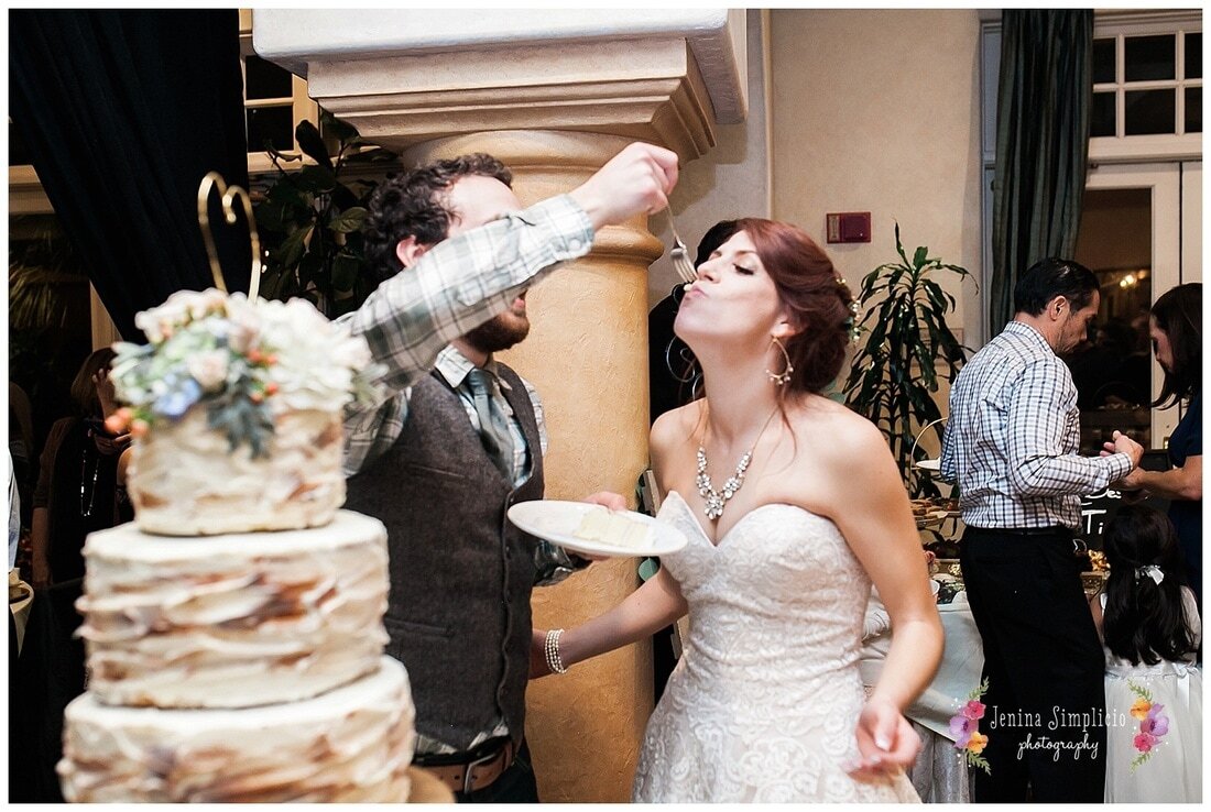  groom feeds cake to the bride 