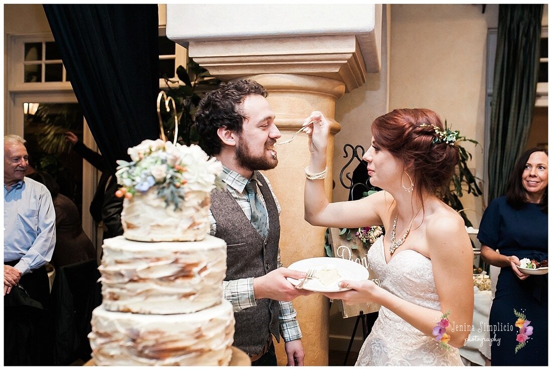  bride feeds cake to the groom 