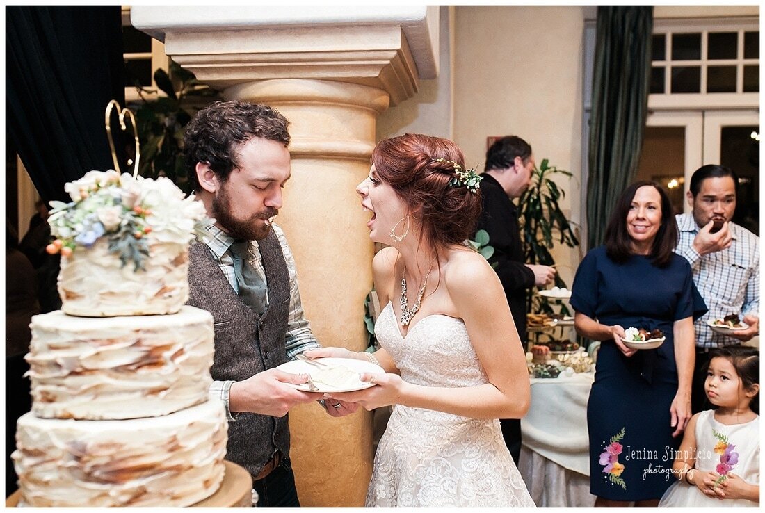  bride and groom enjoying cake together 