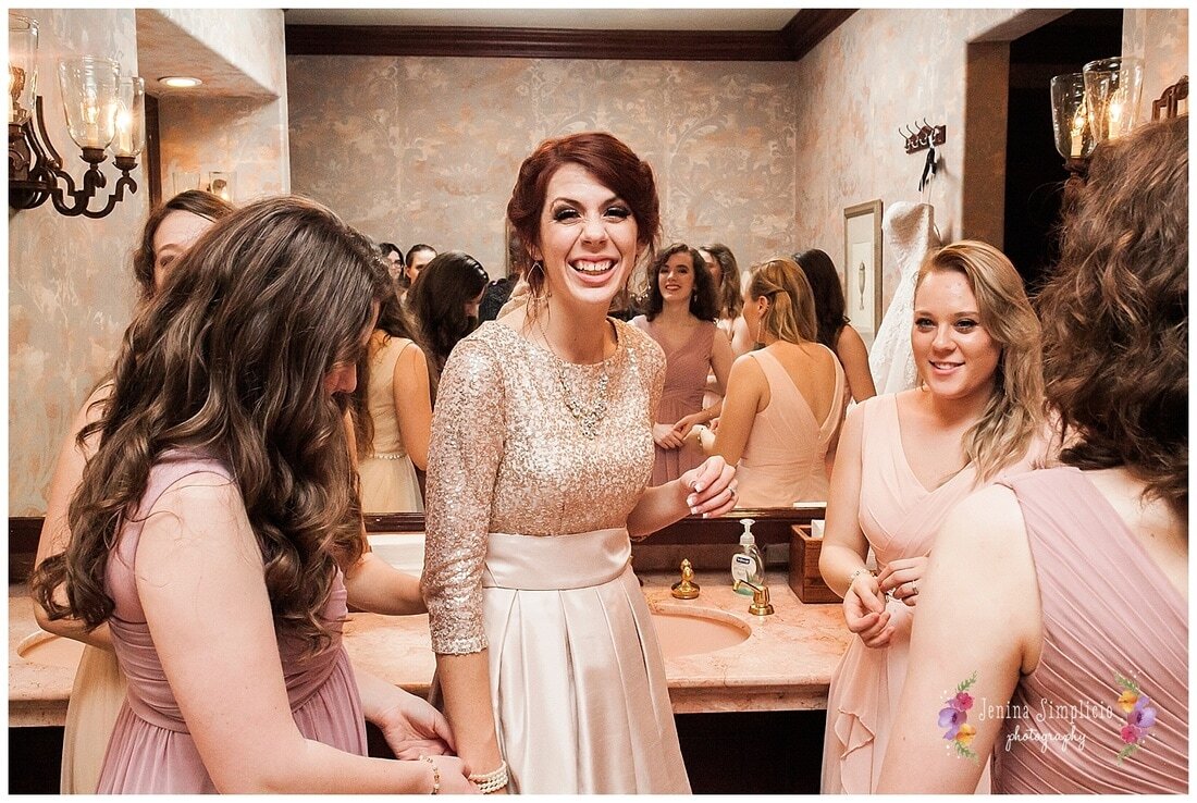  bride and her bridal party in the bathroom 