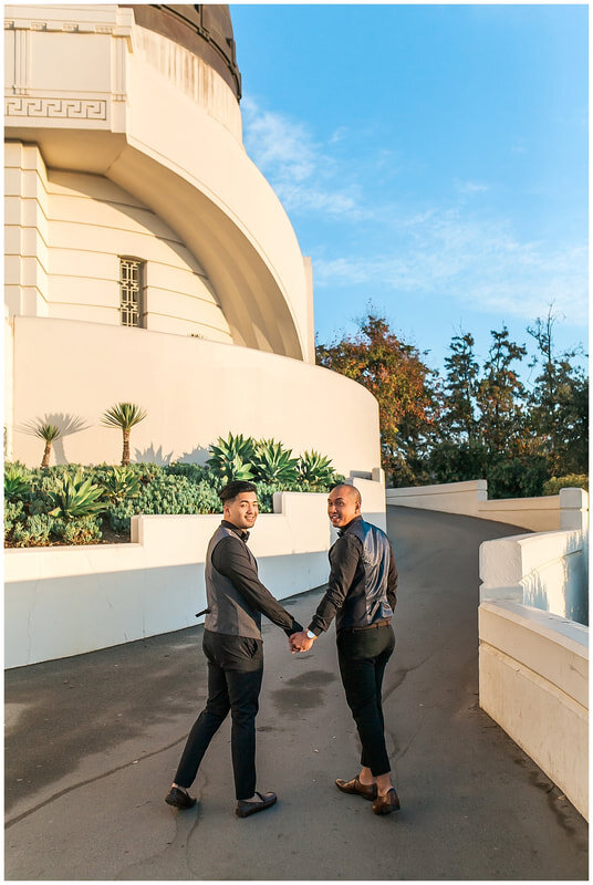  grooms walk around the observatory hand in hand 