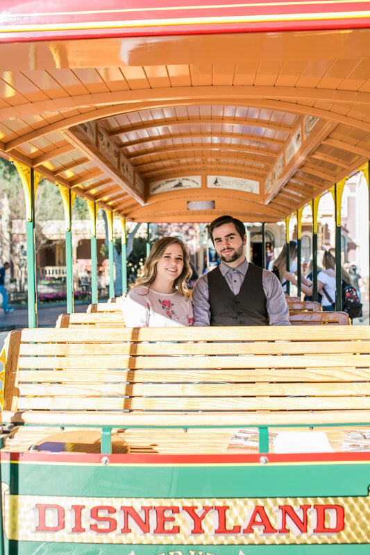  engaged couple on the disneyland trolley 