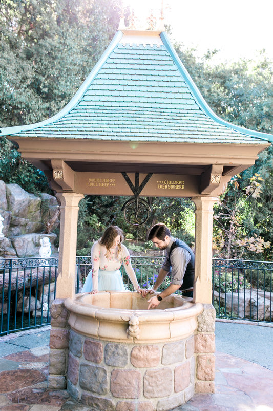  newly engaged couple at the wishing well 