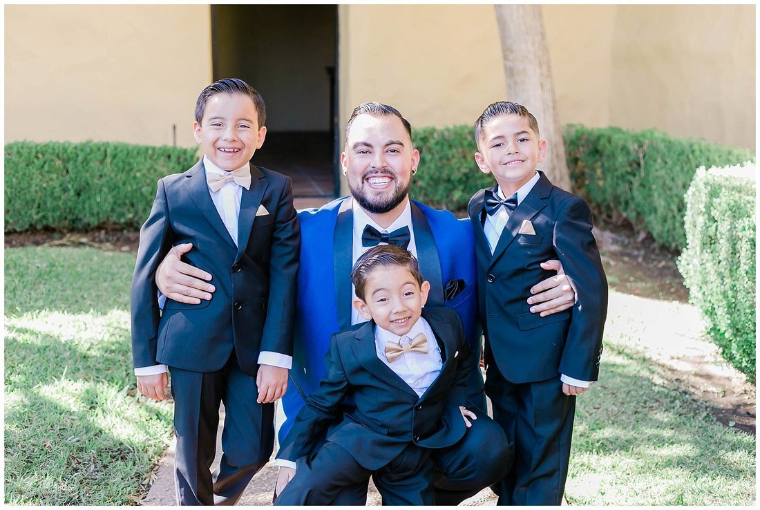  groom with the three ring bearers  
