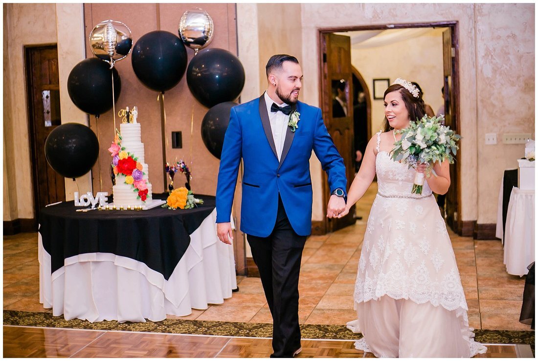  bride and groom entering the reception hall 