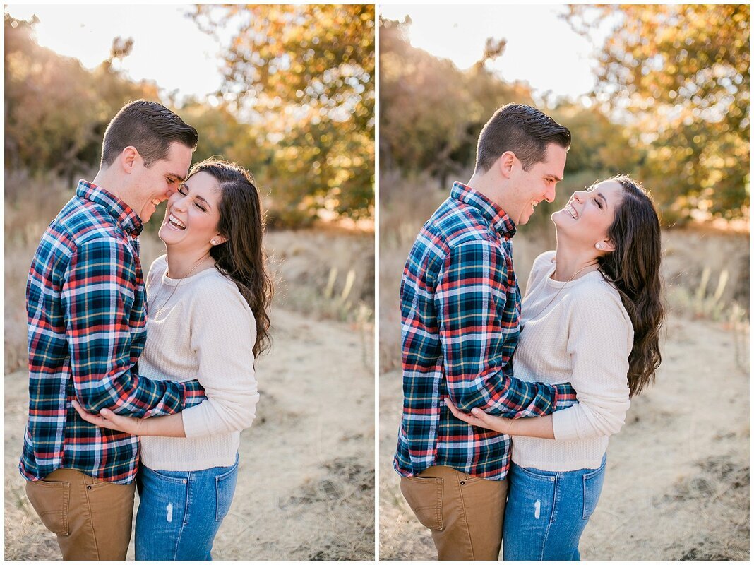  engaged couple laughing in front of greenery 