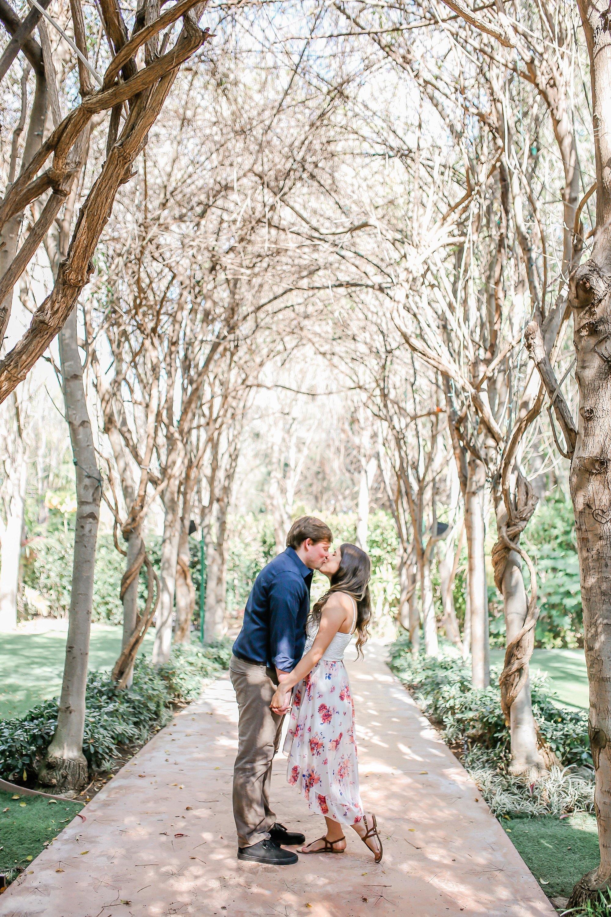  bride and groom kissing in the botanical garden path 