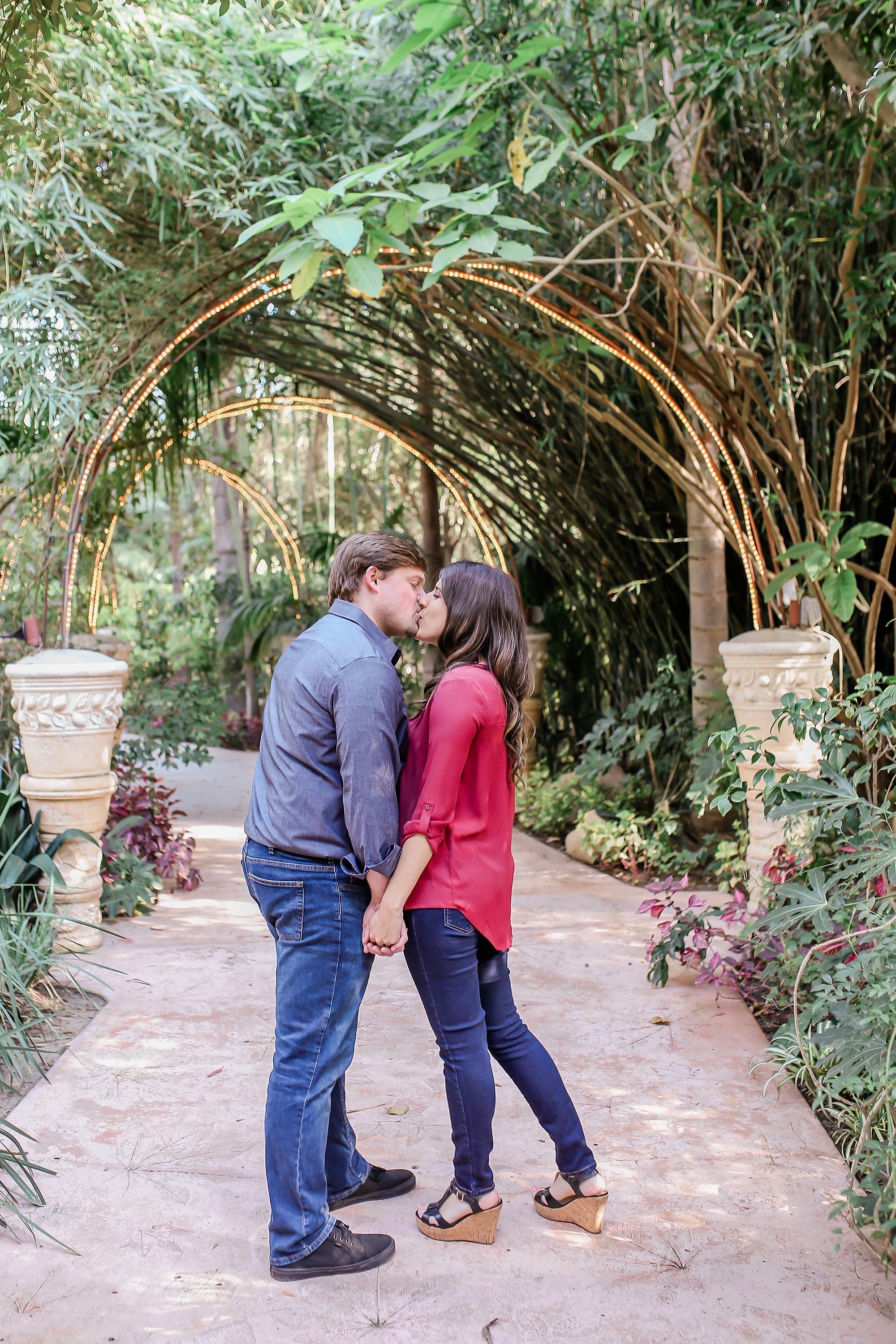  bride and groom kissing in the botanical garden 