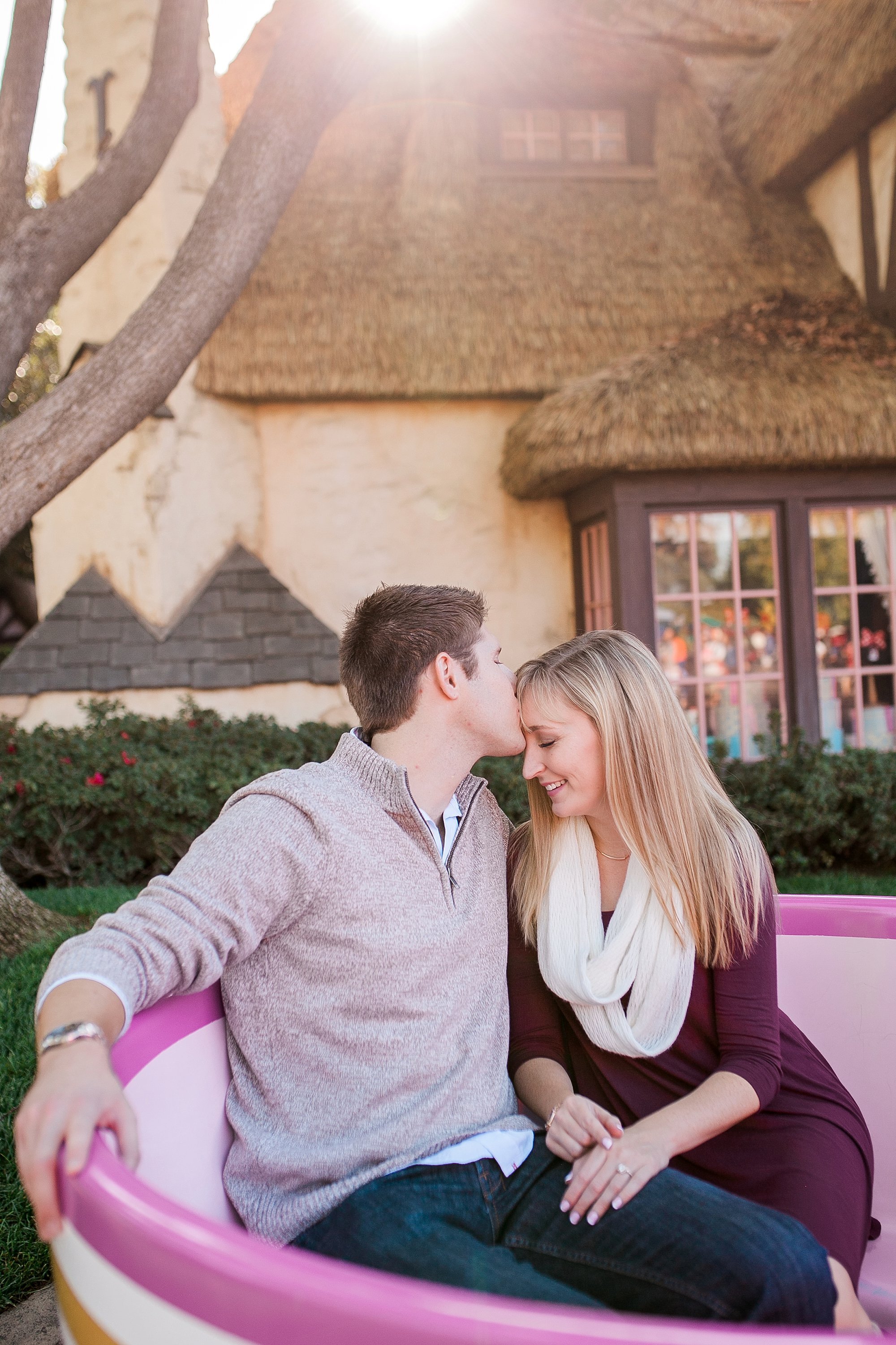  couple sitting in the teacups together 