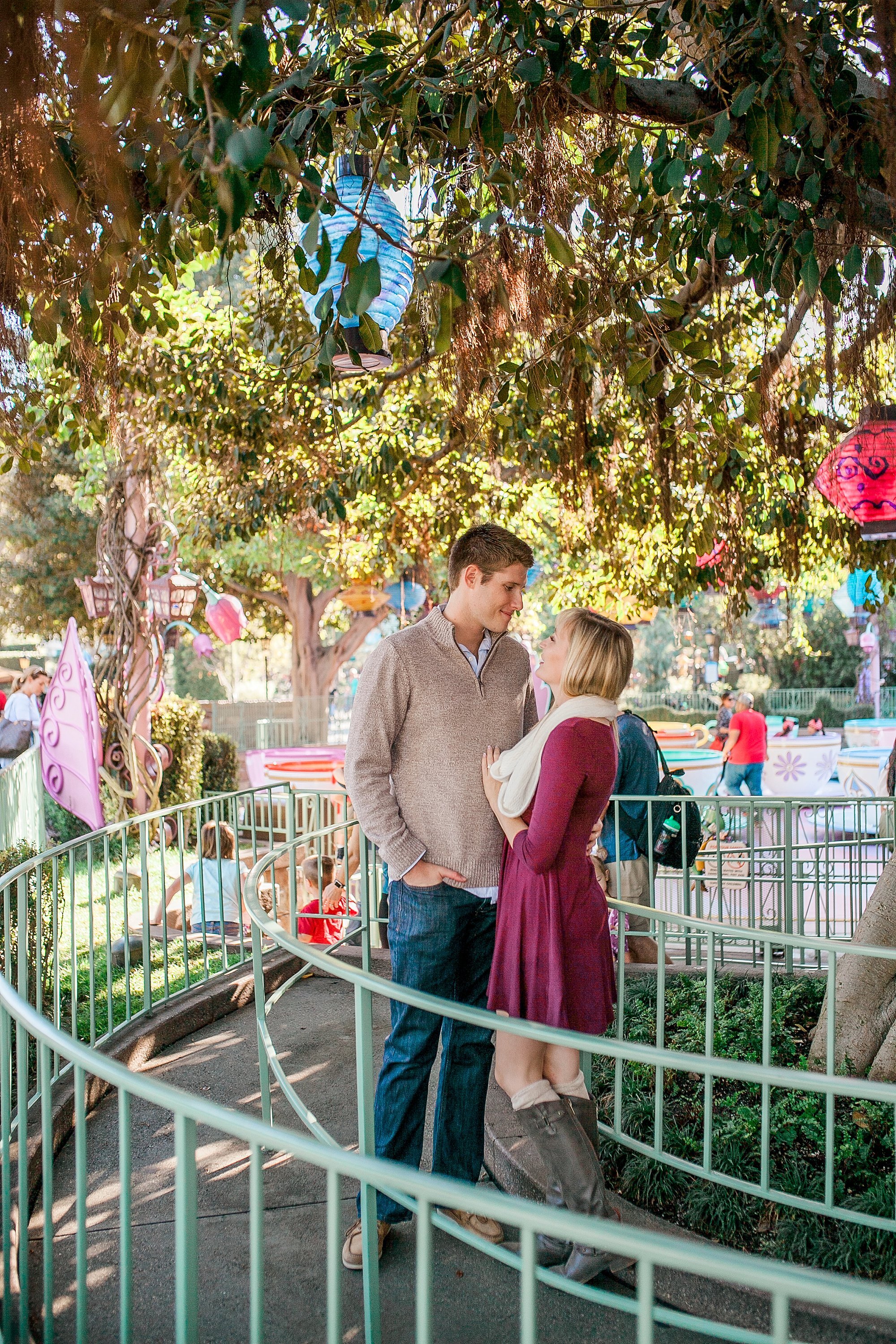  couple standing in the queues of disney rides  