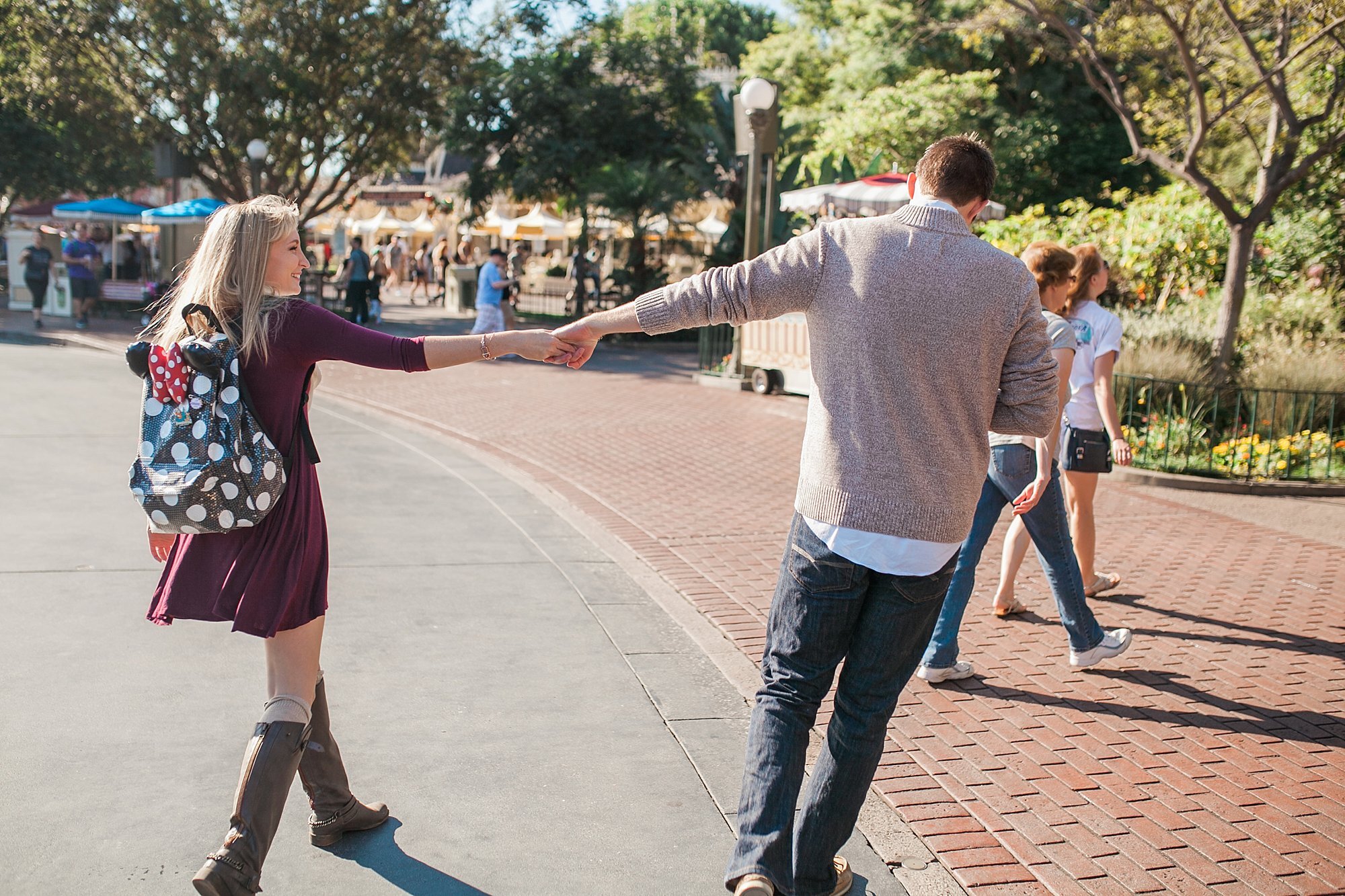  groom to be leads bride to be to the magic kingdom 