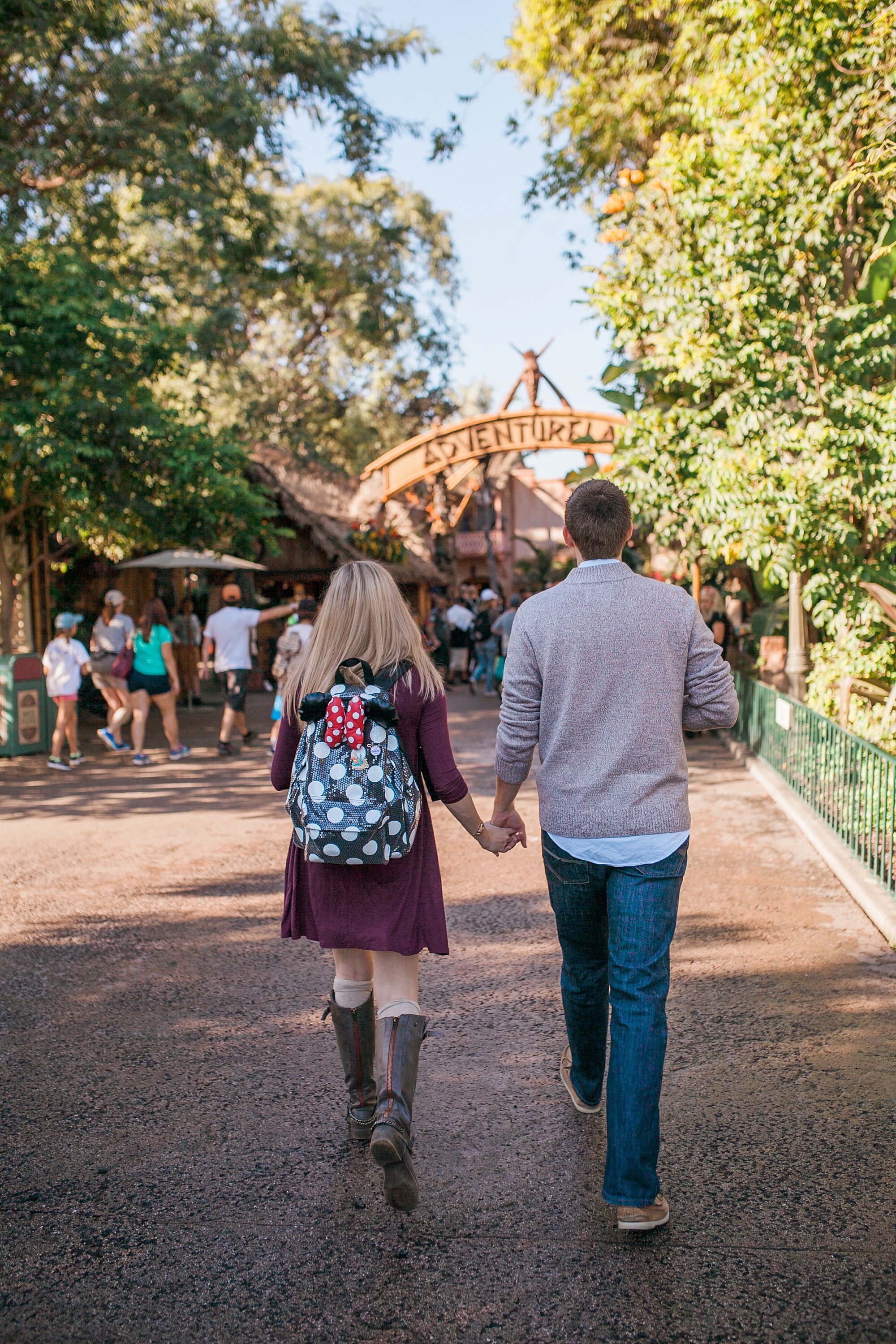  bride to be wearing minnie mouse backpack 