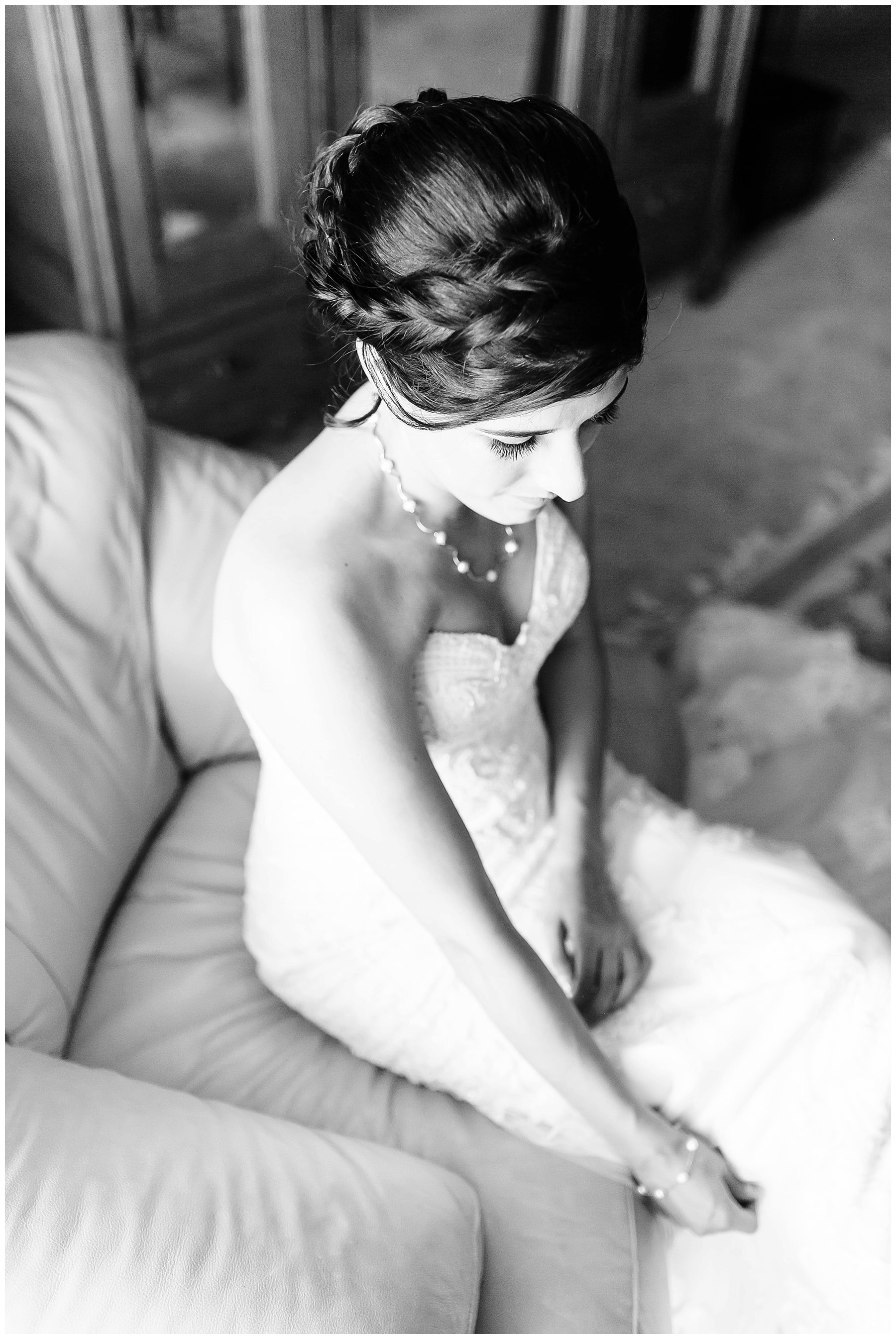  bride sitting on the chair in the bridal suite 