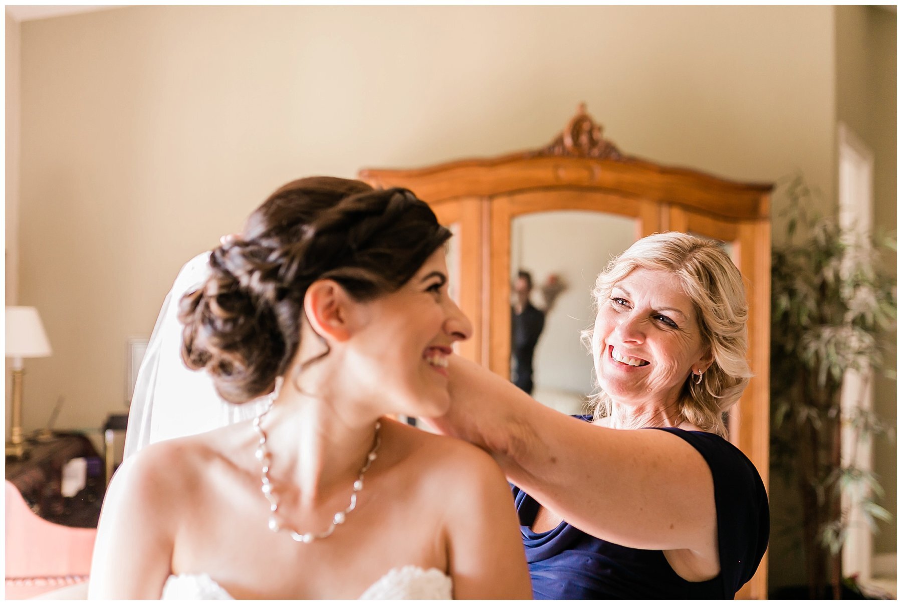  mother of the bride helping the bride get ready 