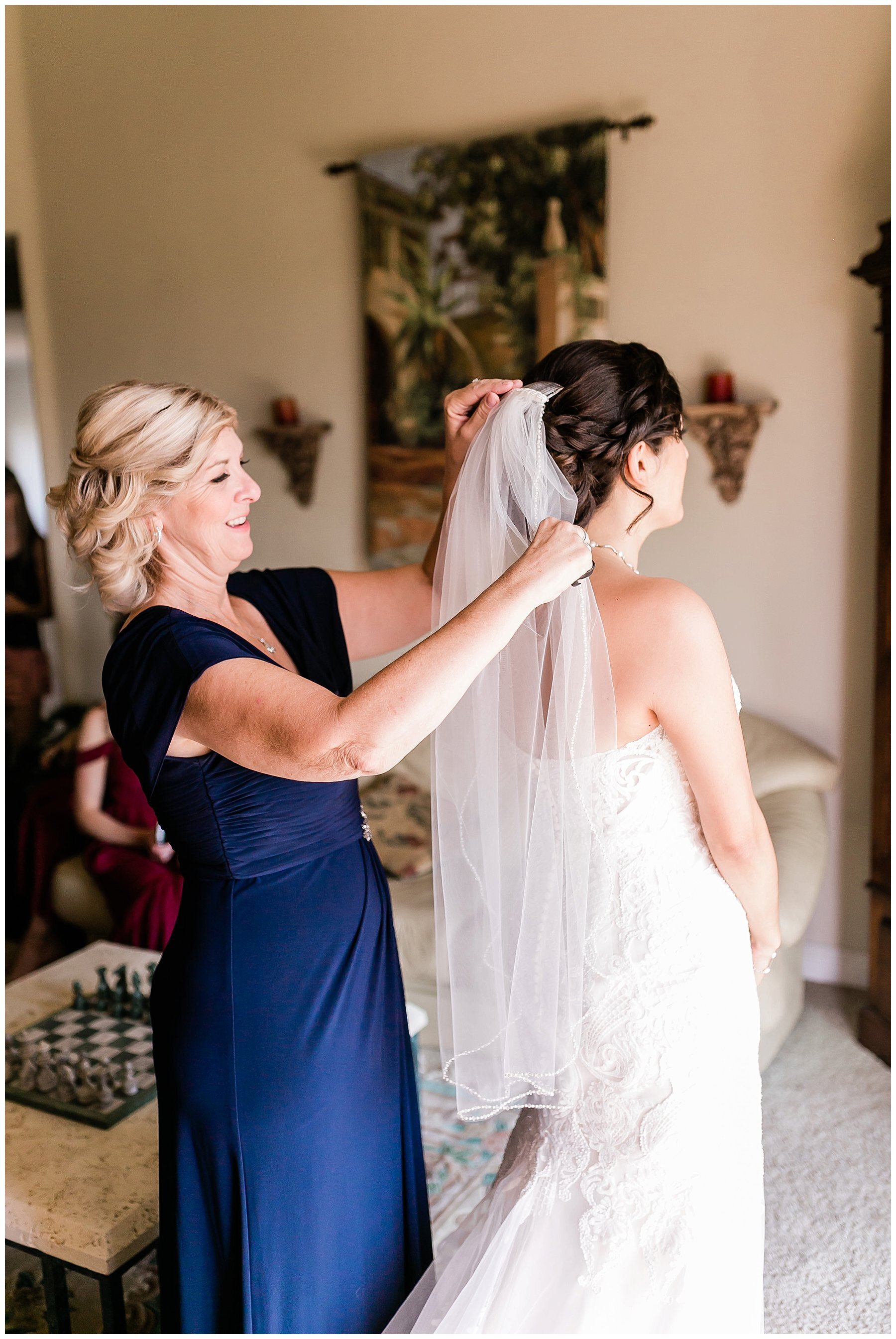  mother of the bride helping the bride get ready 