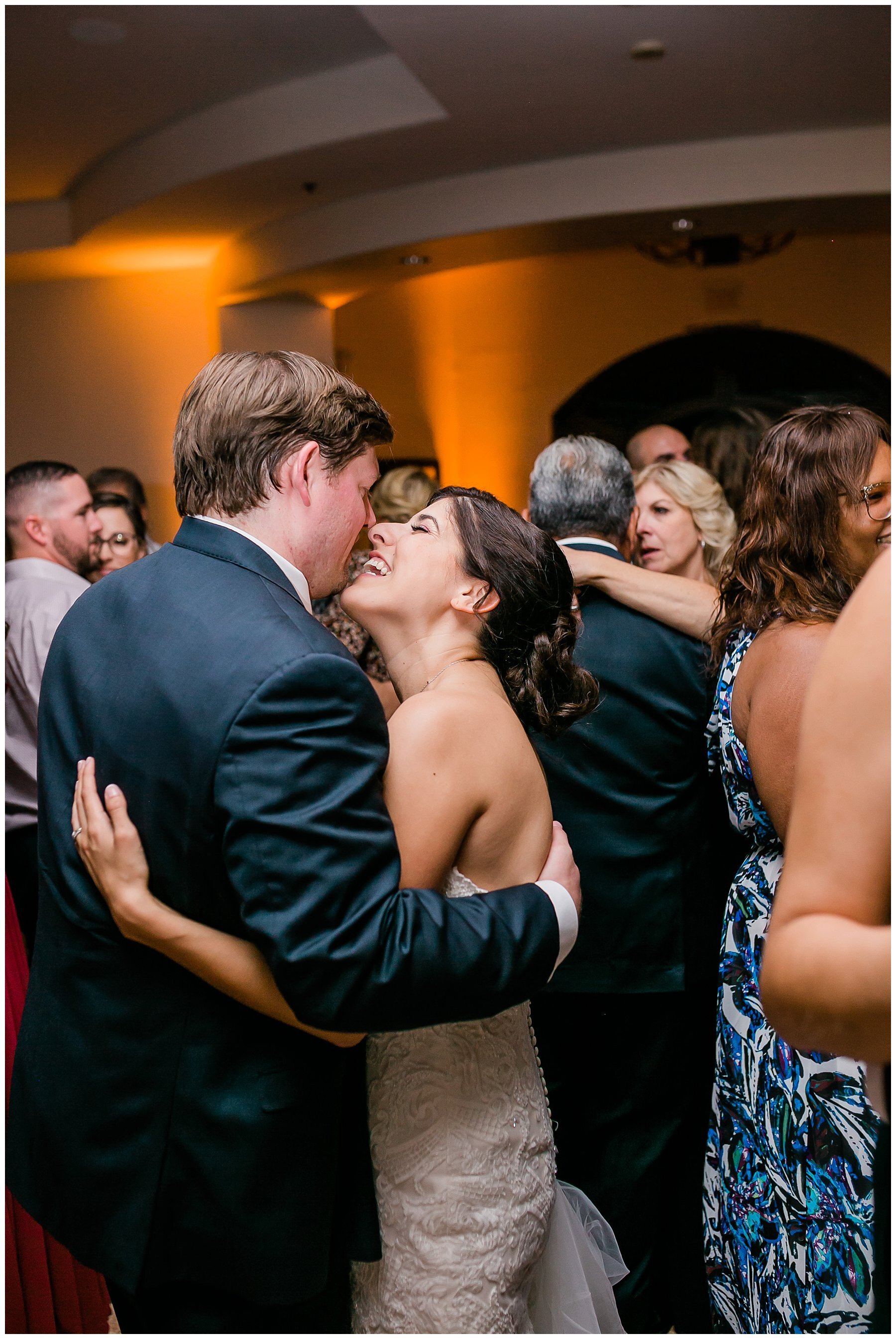  bride and groom kiss on the dance floor 