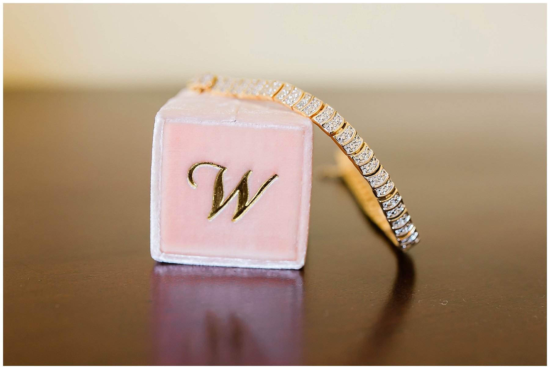  close up of wedding ring box and bracelet 