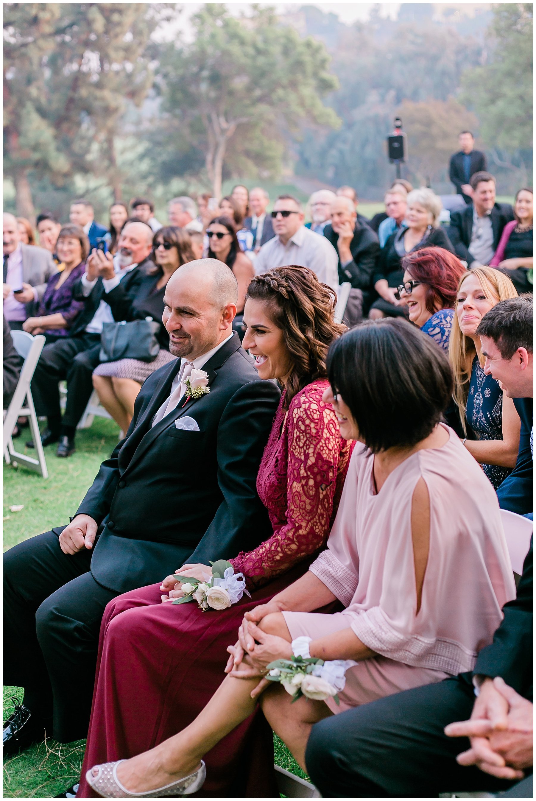  guests watching the bride and groom during the ceremony 