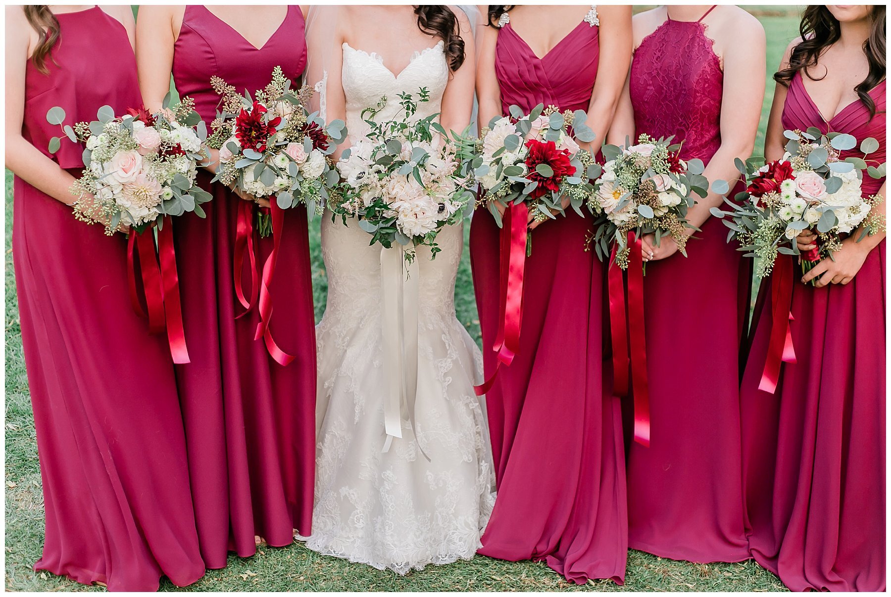  bride and bridesmaids holding their bouquets 