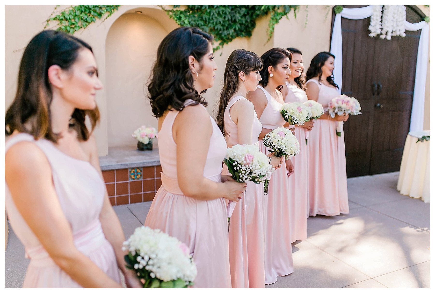  bridesmaids lined up at the altar for the wedding ceremony 