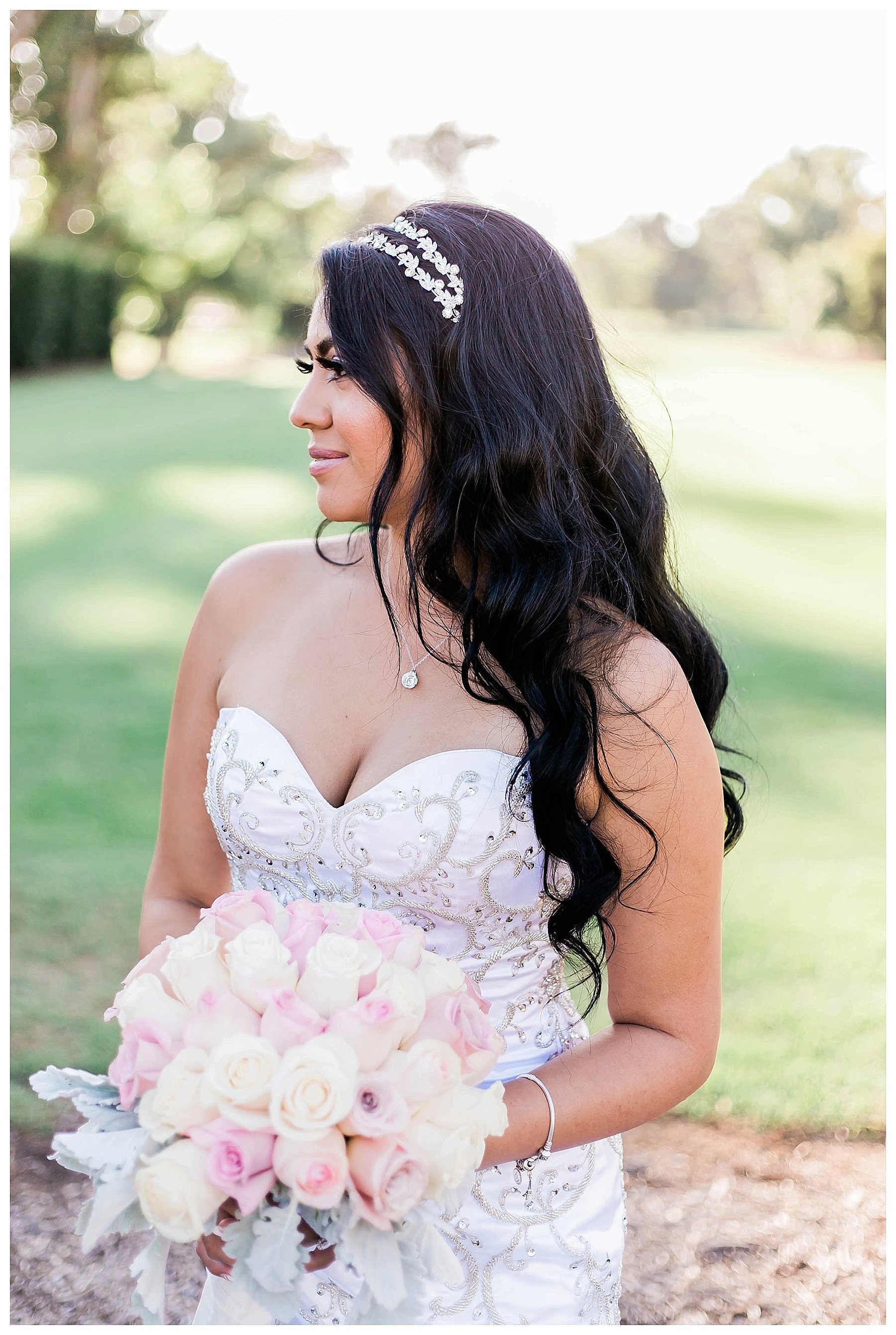  bride looks off into the distance holding her bouquet 