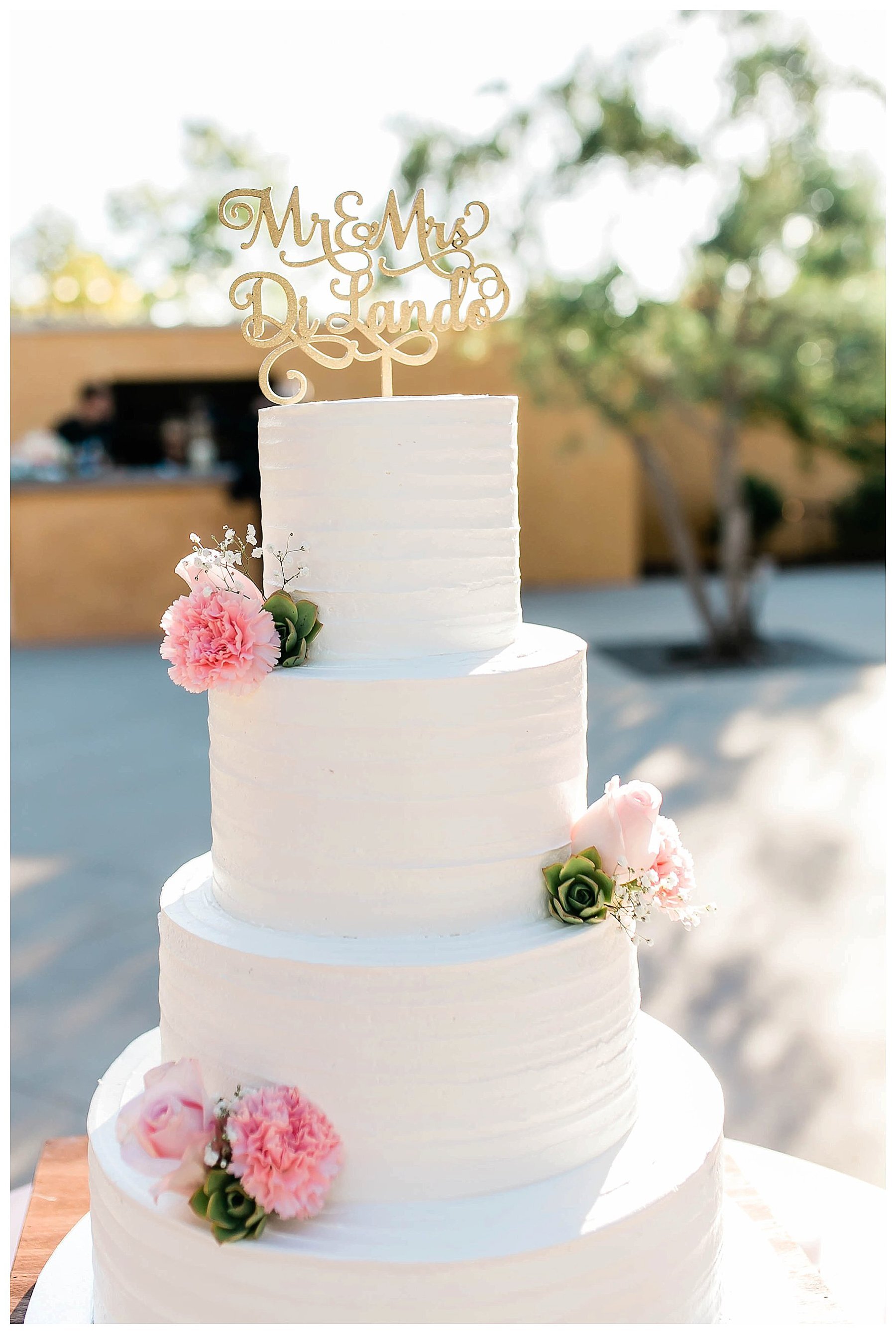  wedding cake with pink flowers on the cake 