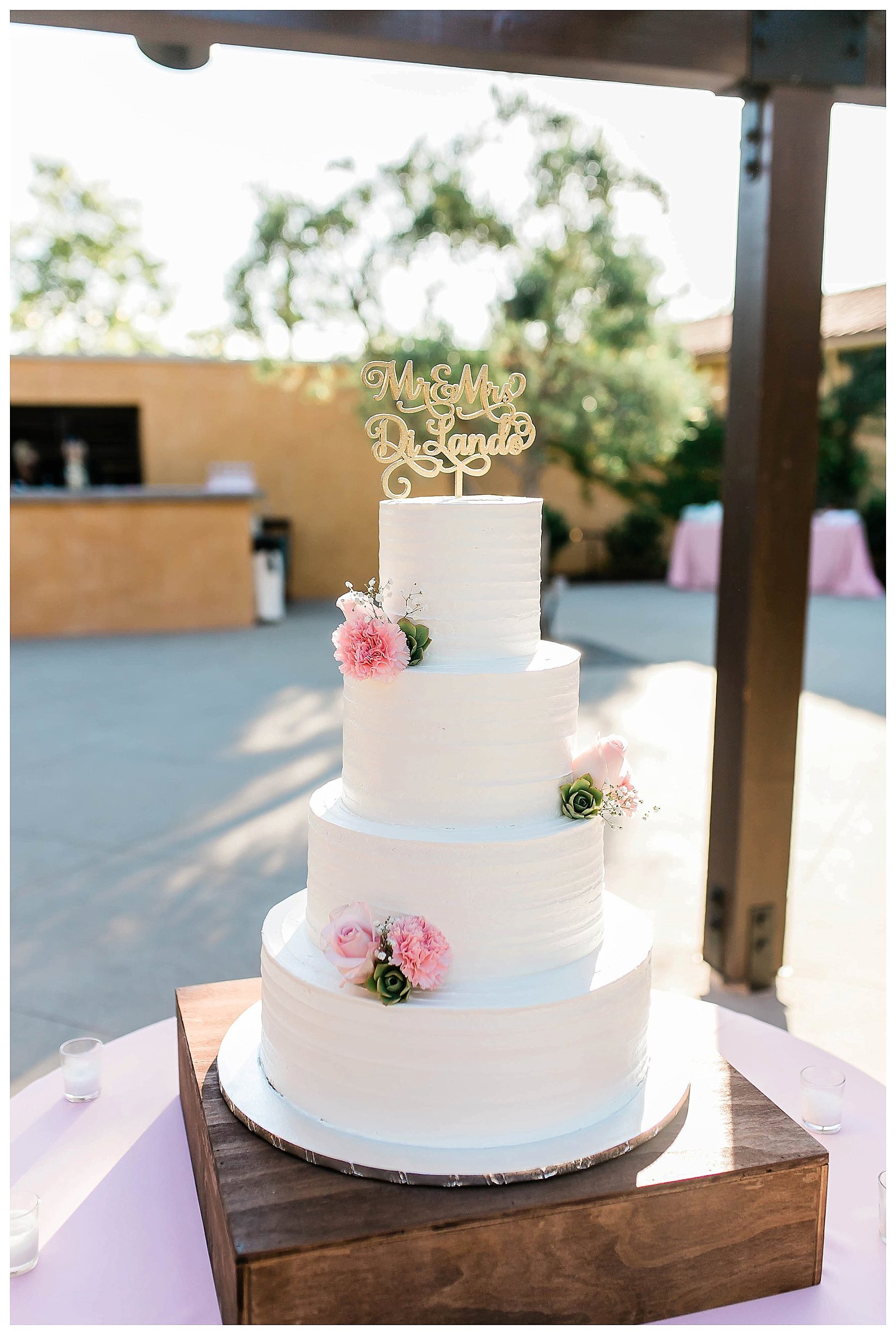  wedding cake with pink flowers on the cake 